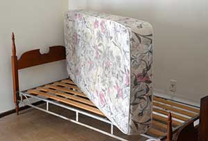 Mattress on top of bed. Mattress Disposal Services and mattress recycling in Portland OR by Mike and Dads Hauling