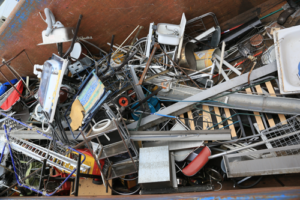 Pile of debris in bin. Scrap Metal Pick Up in Portland OR by Mike & Dad's Hauling